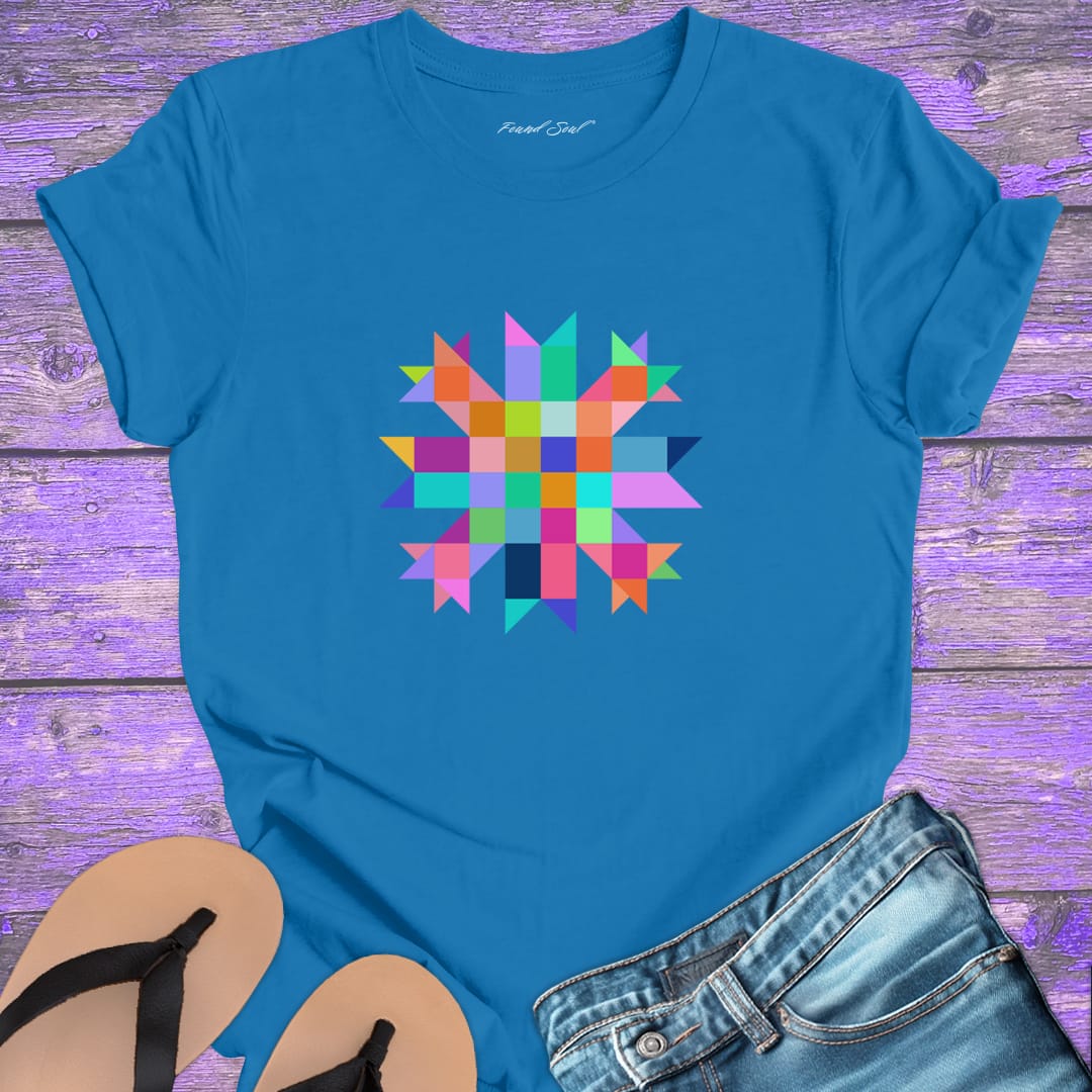 Vibrant mosaic geometric star with colorful angular pieces on blue t-shirt for healing wholeness transformation sacred geometry