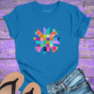 Vibrant mosaic geometric star with colorful angular pieces on blue t-shirt for healing wholeness transformation sacred geometry