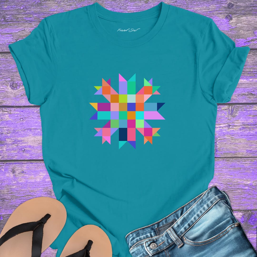 Vibrant mosaic geometric star with colorful angular pieces on turquoise t-shirt for healing wholeness transformation sacred geometry