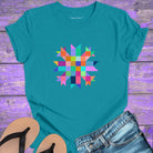Vibrant mosaic geometric star with colorful angular pieces on turquoise t-shirt for healing wholeness transformation sacred geometry
