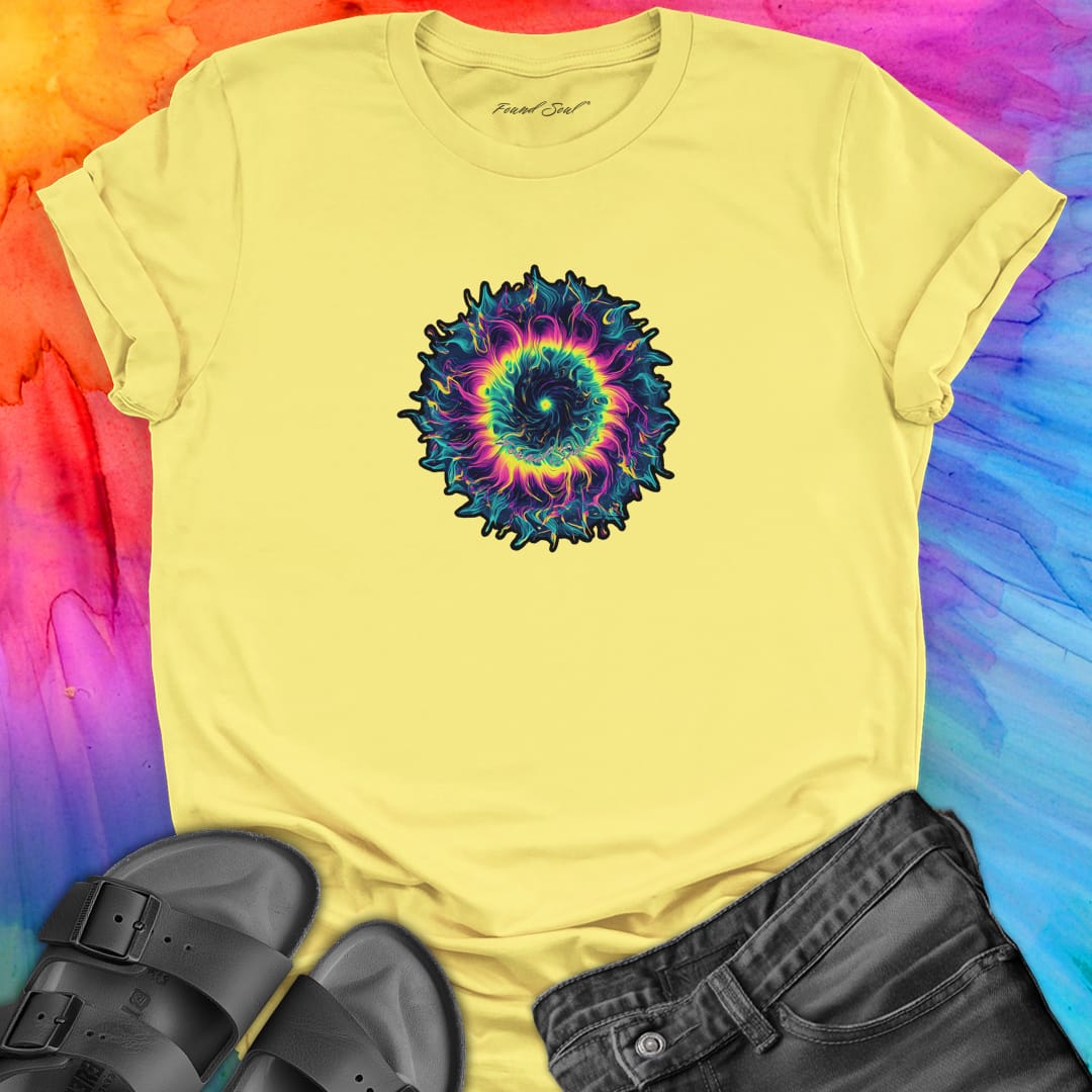 Vibrant rainbow and black spiral mandala on yellow t-shirt for energy frequency.