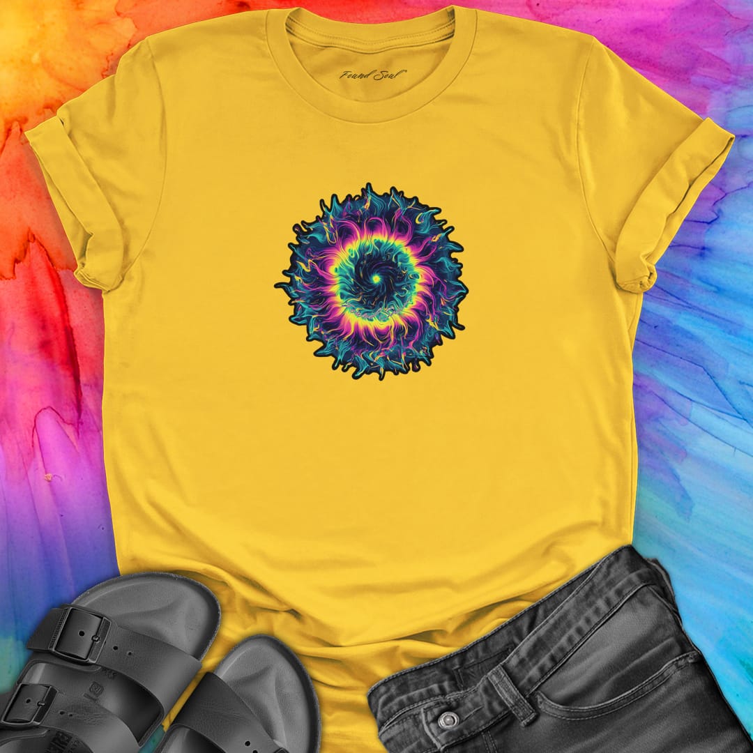 Vibrant rainbow and black spiral mandala on yellow t-shirt for energy frequency.