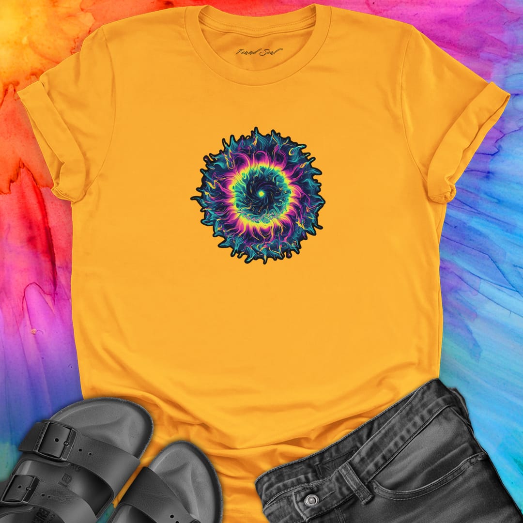 Vibrant rainbow and black spiral mandala on yellow t-shirt for energy frequency.
