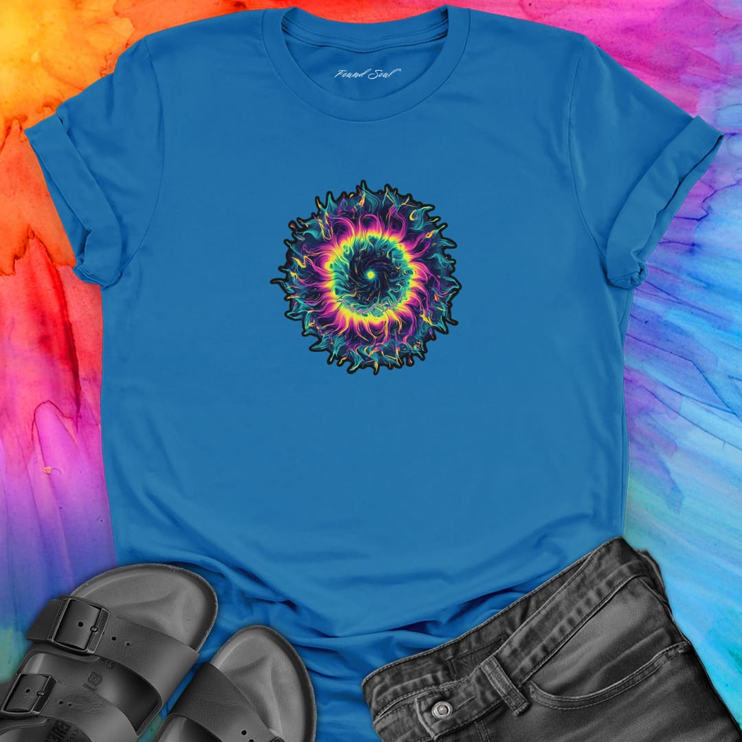 Vibrant rainbow and black spiral mandala on blue t-shirt for energy frequency.