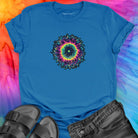 Vibrant rainbow and black spiral mandala on blue t-shirt for energy frequency.
