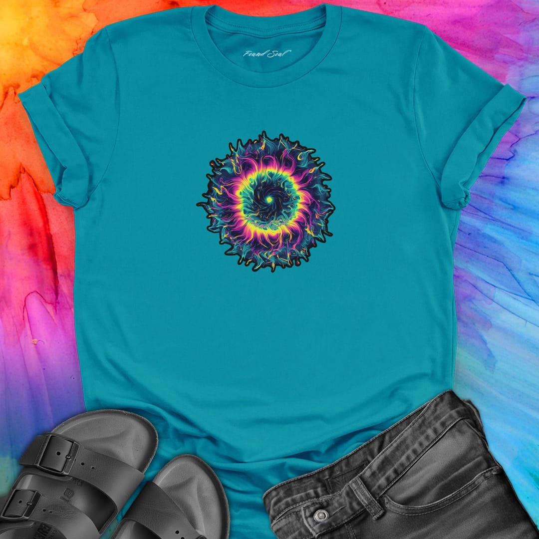 Vibrant rainbow and black spiral mandala on turquoise t-shirt for energy frequency.