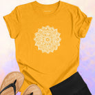 Mandala with delicate petal symmetry on yellow t-shirt for meditation consciousness expansion sacred geometry