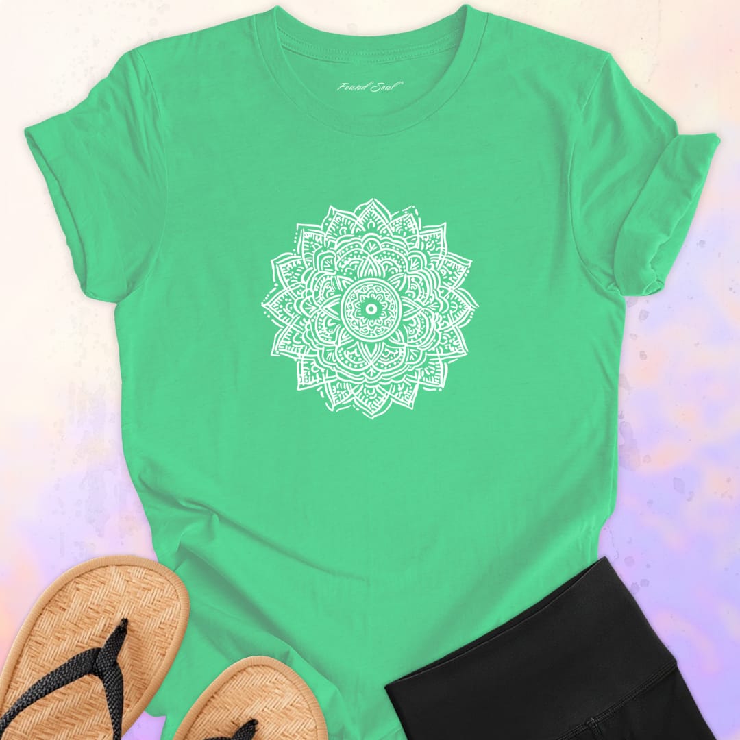 Mandala with delicate petal symmetry on green t-shirt for meditation consciousness expansion sacred geometry