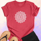 Mandala with delicate petal symmetry on red t-shirt for meditation consciousness expansion sacred geometry