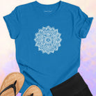 Mandala with delicate petal symmetry on blue t-shirt for meditation consciousness expansion sacred geometry