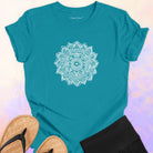 Mandala with delicate petal symmetry on turquoise t-shirt for meditation consciousness expansion sacred geometry