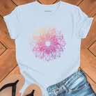 Cosmic mandala starburst radiating galactic energy on light blue t-shirt for solstice cosmic geometry sacred pattern