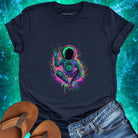 Meditating astronaut in nebula and waving hello navy t-shirt for cosmic peace and spiritual exploration.