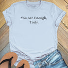You are enough truly light blue t-shirt, a symbol of self-love and worthiness affirmation apparel.