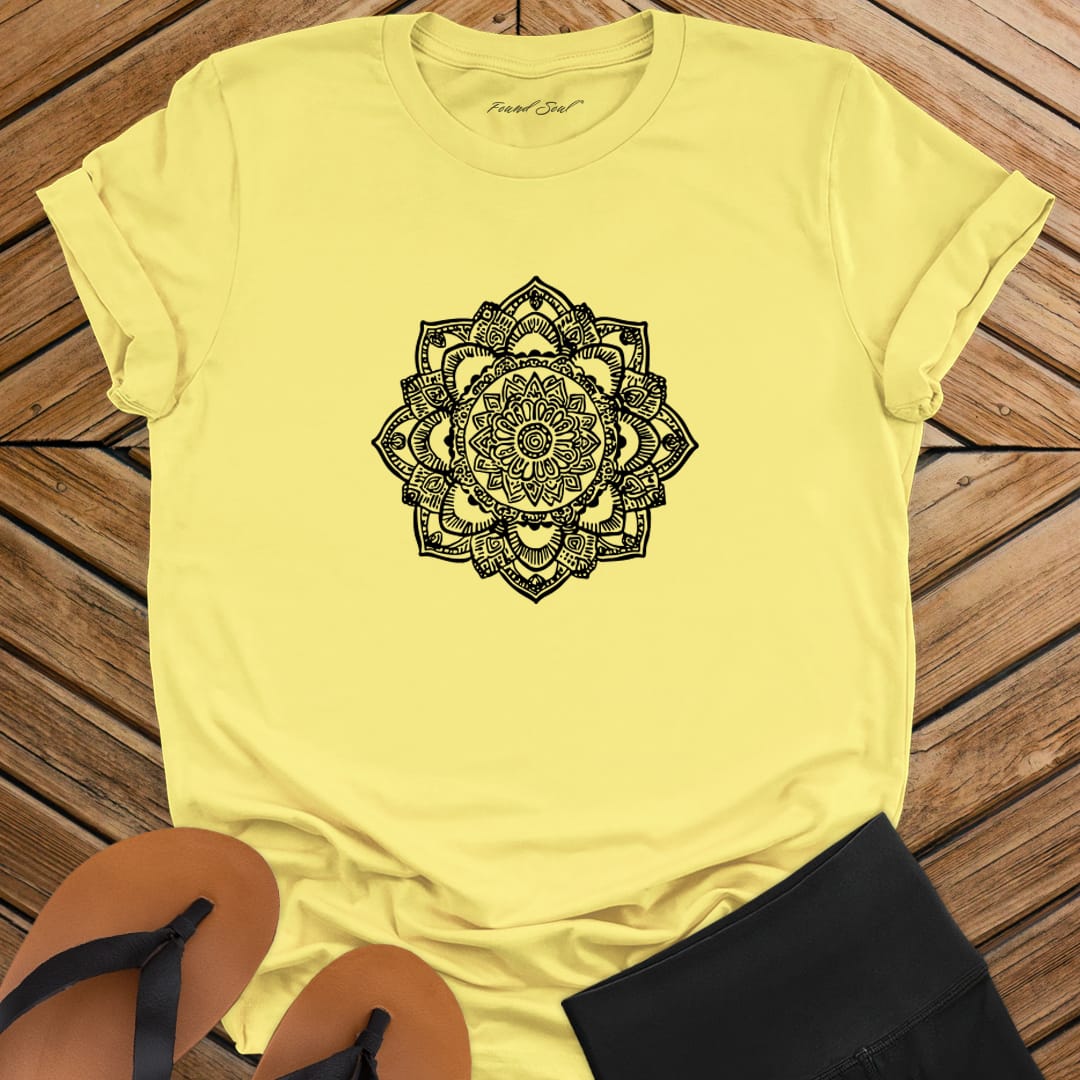Intricate mandala with delicate line work on yellow t-shirt for zen meditation stillness sacred geometry detail awareness