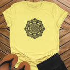 Intricate mandala with delicate line work on yellow t-shirt for zen meditation stillness sacred geometry detail awareness