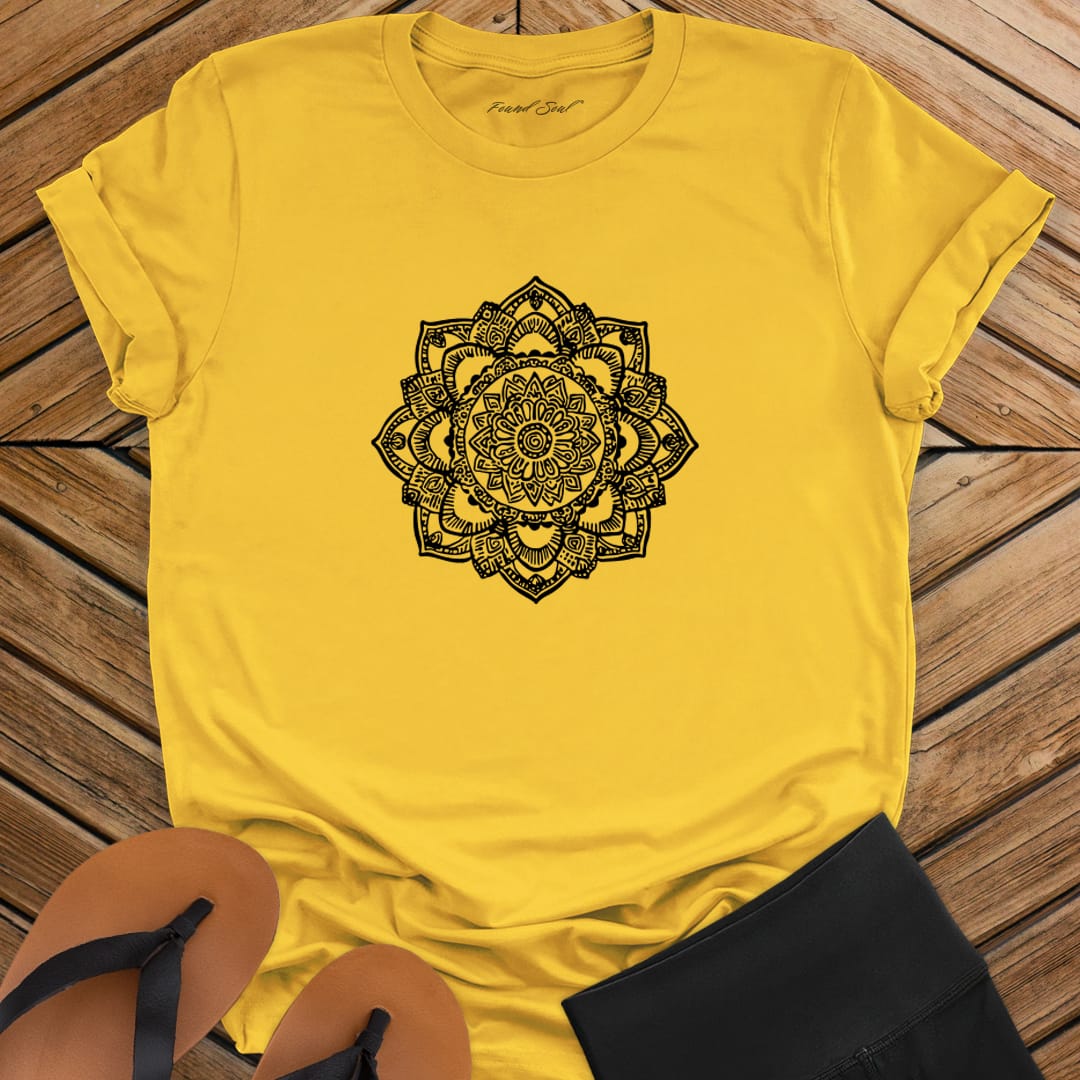 Intricate mandala with delicate line work on yellow t-shirt for zen meditation stillness sacred geometry detail awareness