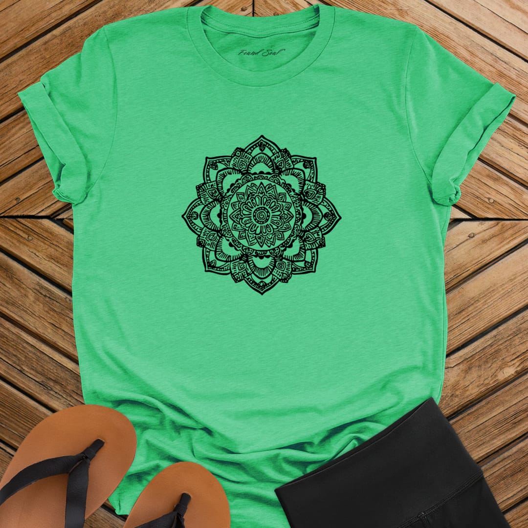 Intricate mandala with delicate line work on green t-shirt for zen meditation stillness sacred geometry detail awareness