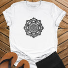 Intricate mandala with delicate line work on white t-shirt for zen meditation stillness sacred geometry detail awareness