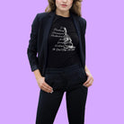 Woman wearing Guanyin goddess meditation black t-shirt with compassion and boundaries message.