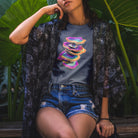 Woman wearing vibrant stacked rainbow turkey tail mushrooms grey t-shirt for layered growth shadow rising mushroom wisdom spiritual building light seeking nature